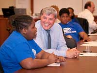 A QBE employee provides career advice to a youth during a service project with Boys & Girls Clubs of America.
